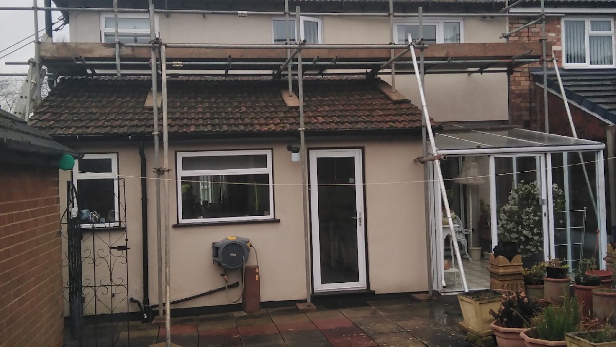 Scaffold over a rear extension and conservatory